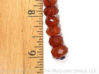 9" Strand of Carved Faceted Amber Beads. 