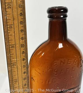 Amber Brown Warner's Safe Kidney & Liver Cure Rochester NY Embossed Bottle. 10"T