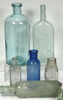 Six (6) Glass Bottles Including Torpedo Bottle
