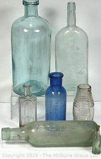 Six (6) Glass Bottles Including Torpedo Bottle
