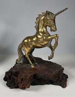 Metal Unicorn statue on wood base