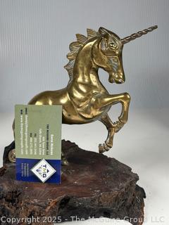 Metal Unicorn statue on wood base