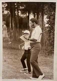 6 x 8" Photo of Calvin Peete Signing Autograph While Playing Kemper Open Golf Tournament.  