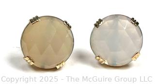 Pair of Faceted Cabachon Gemstones Set in 14KT Yellow Gold Bezel and Posts. 