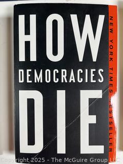 Seven (7) Hard Cover Books Including How Democracies Die and John Lennon Biography 