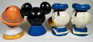 Four (4) Walt Disney Coin Piggy Banks in the Shape of Pinocchio, Mickey Mouse and Donald