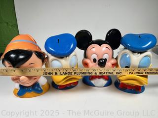 Four (4) Walt Disney Coin Piggy Banks in the Shape of Pinocchio, Mickey Mouse and Donald
