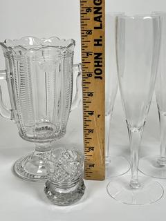 Collection of Clear Glassware Including Celery Vase, Toothpick Holder and 
Five (5) Champagne Flutes