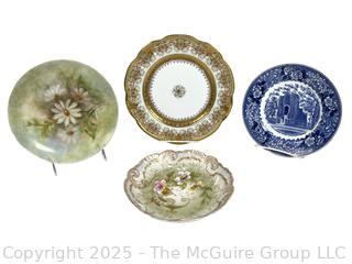 Four (4) Porcelain Plates.