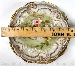 Four (4) Porcelain Plates.