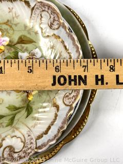 Four (4) Porcelain Plates.