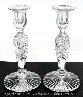 Pair of Cut Crystal Candlesticks. Small chip in base.  9" tall.