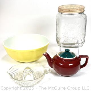 Yellow Pyrex Mixing Bowl, Reamer, Teapot and Monarch Finer Foods Jar.