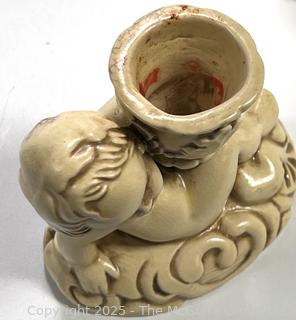 Three (3) Piece Pottery Candle Holders and Vase with Cherubs 