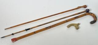 Three (3) Canes, Walking Sticks and Converted Umbrella,Plus a Brass Cane Top.