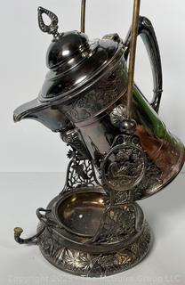C 1850's Victorian Silver Plated Tilting Water Pitcher and Stand. Measures 22" Tall with Handle Up