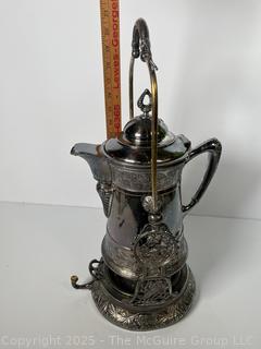C 1850's Victorian Silver Plated Tilting Water Pitcher and Stand. Measures 22" Tall with Handle Up