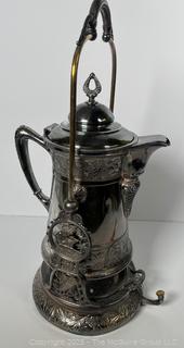 C 1850's Victorian Silver Plated Tilting Water Pitcher and Stand. Measures 22" Tall with Handle Up