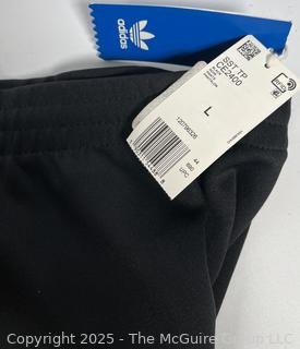 Women's Black & White Stripe Knit Track Pants by Adidas, Large.  New with Tags