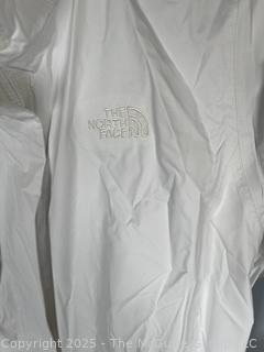 Women's White Rain Jacket by The North Face, Large. New with Tags