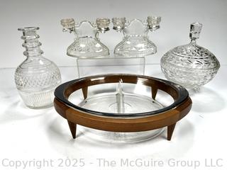 ????????????????? Two section serving dish in MCM Teak footed server; Pair of Vintage Crystal Double Taper Candle Holders; Crystal Decanter and Lidded Bowl