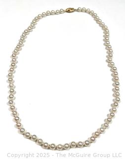 Knotted Pearl Necklace with 14KT Yellow Gold Clasp.