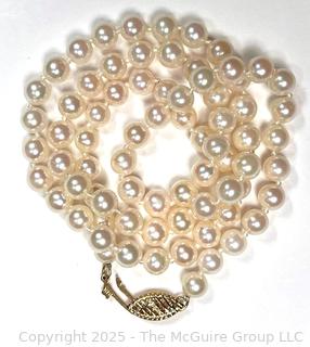 Knotted Pearl Necklace with 14KT Yellow Gold Clasp.