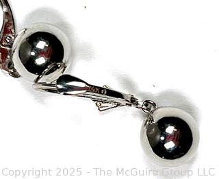 14KT White Gold Bead Dangle Earrings. .01 grams.