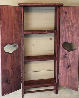 Primitive knotty pine cabinet with doors and towel rack 