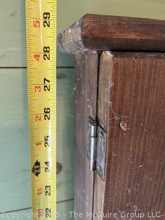 Primitive knotty pine cabinet with doors and towel rack 