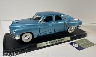 Odd Trio: Model Die Cast Car 1948 Tucker Torpedo. American; Spittoon; and Copper tea kettle w/ porcelain accents