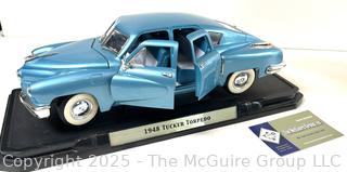 Odd Trio: Model Die Cast Car 1948 Tucker Torpedo. American; Spittoon; and Copper tea kettle w/ porcelain accents