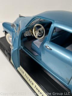 Odd Trio: Model Die Cast Car 1948 Tucker Torpedo. American; Spittoon; and Copper tea kettle w/ porcelain accents