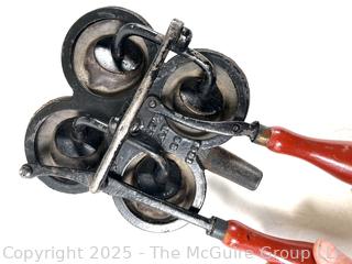 Early Mechanical Milking Machine with Red Wood Handles