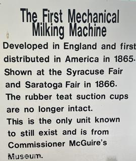 Early Mechanical Milking Machine with Red Wood Handles