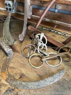 Grouping of Bench Tools Including Sickles, Hack Saw, Horse Bits, Hand Drill Brace and Large Axe Head  
