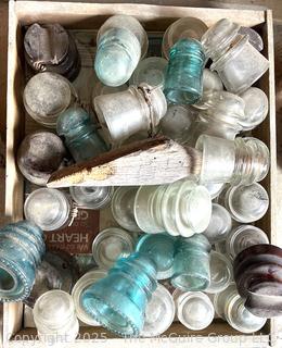 Group of antique glass insulators: various brands and colors
