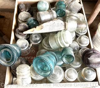 Group of antique glass insulators: various brands and colors