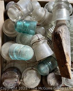 Group of antique glass insulators: various brands and colors