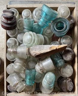 Group of antique glass insulators: various brands and colors