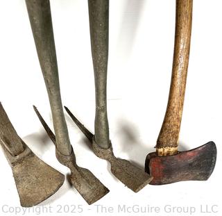 Four hand tools: axe; adz; and pick mattocks