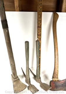 Four hand tools: axe; adz; and pick mattocks
