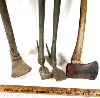 Four hand tools: axe; adz; and pick mattocks