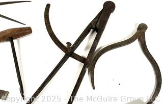 Calipers; compasses; whet stones 