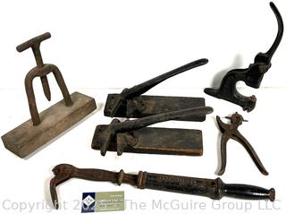 Antique tools: perforator; nail puller; leather hole punch; grommet vise; and 2 Cork Crimping Tool Cast Iron One Mounted on Wood Base by Seargent & Co
