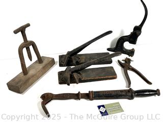 Antique tools: perforator; nail puller; leather hole punch; grommet vise; and 2 Cork Crimping Tool Cast Iron One Mounted on Wood Base by Seargent & Co