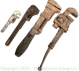 Four (4) vintage monkey wrenches