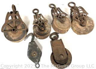 Grouping of cast iron pulleys including Lane Bros. Poughkeepsie NY 