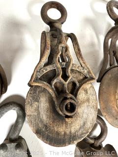 Grouping of cast iron pulleys including Lane Bros. Poughkeepsie NY 