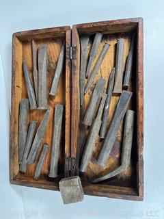 Wood box of tools: cold steel chisels and punches